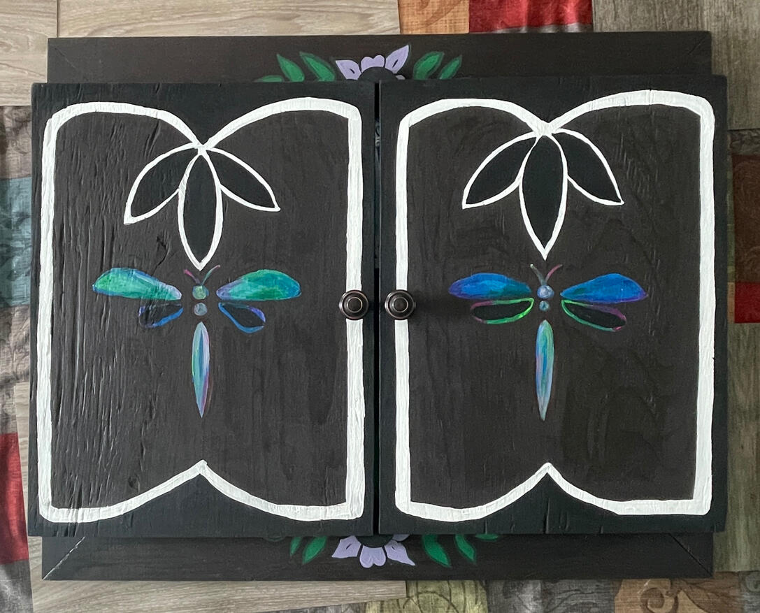 Lewis Hills (Closed view) Dimensions: 28 in x 32 in Medium: Acrylic and Beadwork on canvas, housed in wooden cabinet Date: 2025